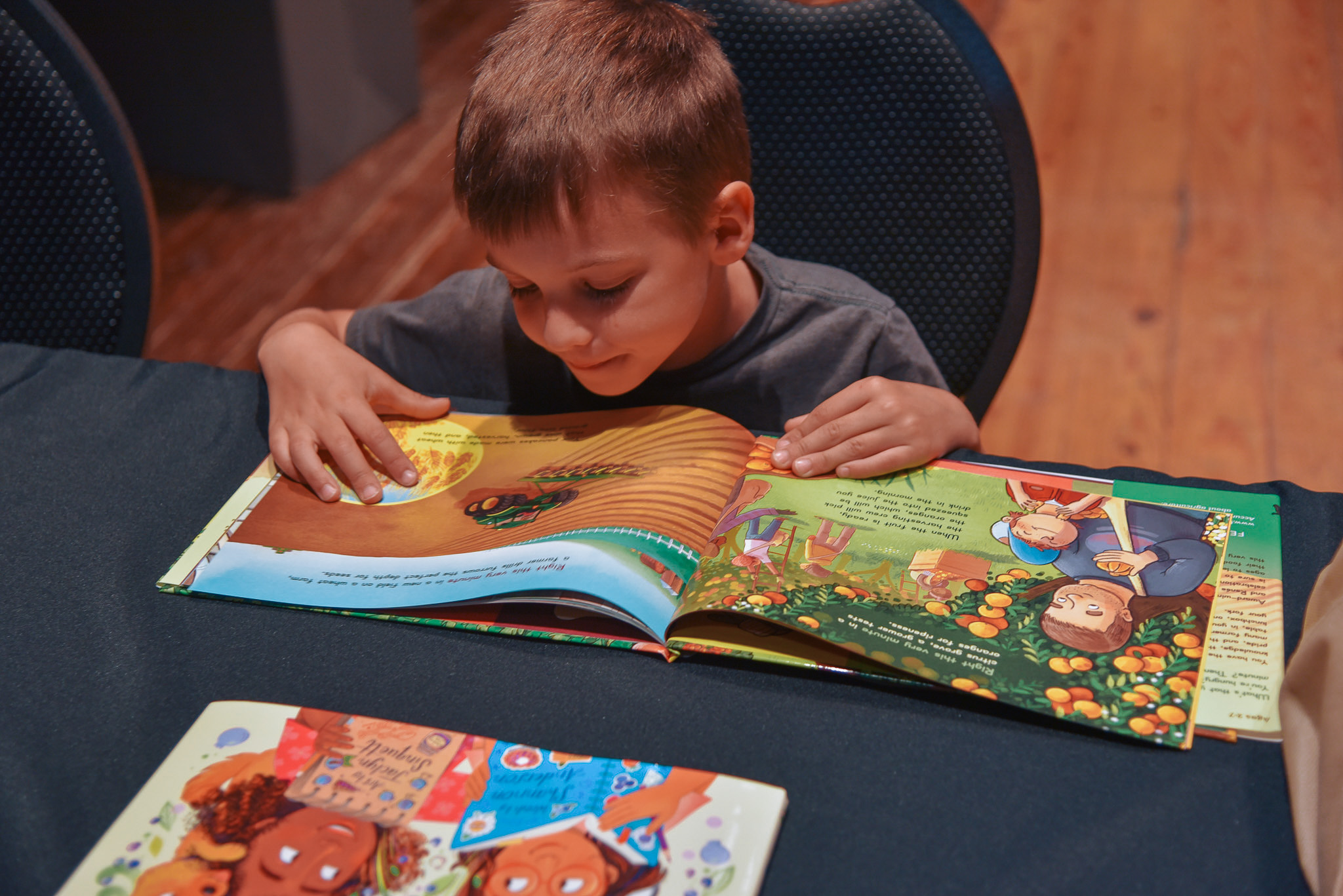 Child reading a book.