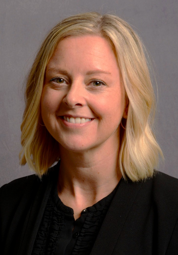 Professional headshot of a woman.